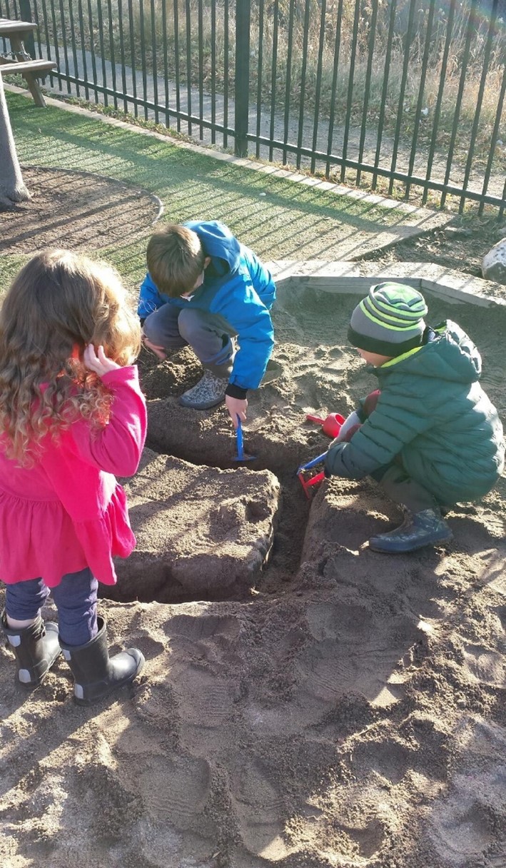 Children are playing in the sandbox